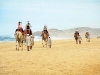 Writer Cassandra Tatone, left, takes the lead on a Camel and Outback Safari