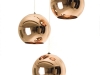 You can hang this spherical copper light alone or in groups to form shiny chandeliers. Either way, this gleaming Tom Dixon fixture reflects its stunning surroundings. 