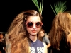 A Mara Hoffman model sports a pair of ’70s-inspired shades, showing off the line’s classic, cool vibe.