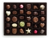 SWEET & SWANKY - This platter of luxury chocolates with Swarovski Elements will bewitch your guests.  www.godiva.com