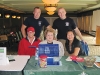 Volenteers Debra Robinson, Shirley Hall and Linh Hang, along with firefighters.