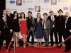 Actors who have worked with Reel Film Pictures gather for a group shot on the red carpet.