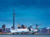 A Dash 8 Q400 Turboprop touches down at Billy Bishop Toronto City Airport.
