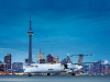  A Dash 8 Q400 Turboprop touches down at Billy Bishop Toronto City Airport.