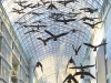 Flight Stop, 1979. Sixty suspended fibre-glass Canada geese forms surfaced with tinted black and white photographs. 3200 x 2000 x 1600 cm. Collection of the Eaton Centre, Toronto