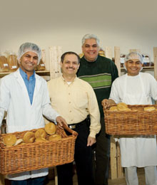 Third from left, president and founder of BioBake Maurizio Barbieri and his devoted team prepare delicious, organic breads daily. 